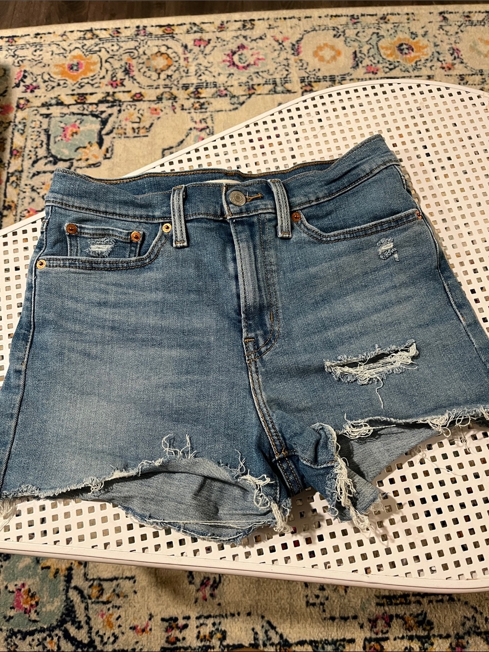 LEVI High-Rise Distressed Denim Shorts in Blue, size 28